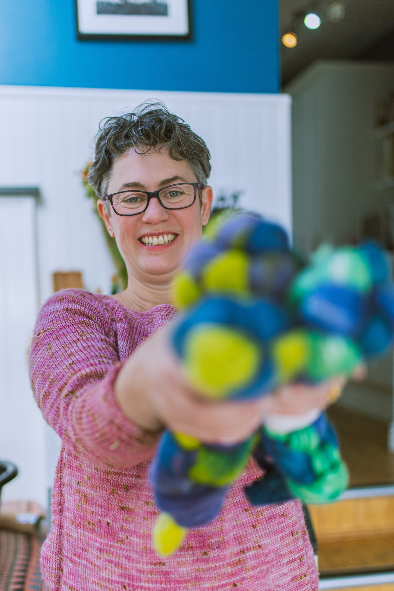 Gemma Regalado photoshoot for Cat & Sparrow Rachael Prest holds a selecton of coloured fibres for spinning. Photo by Gemma Regalado Bristol Brand photographer